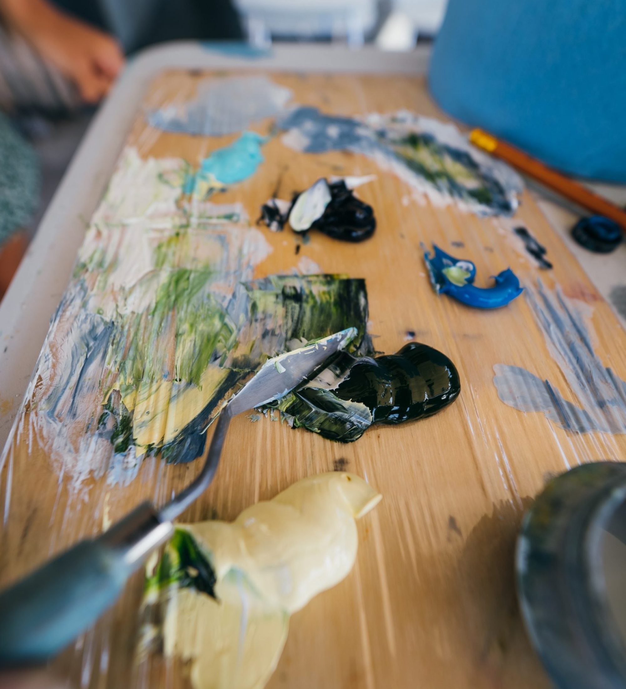 Hand mix paints in palette in art-class